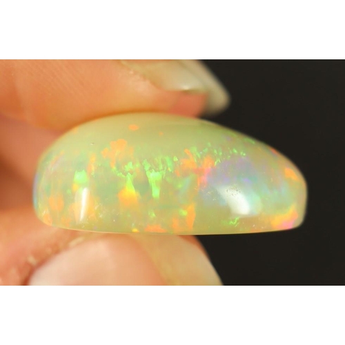 48 - GEMSTONE 28ct ETHIOPIAN OPAL. Pear shape with an opaque white dominance and splashes filling the bod... 