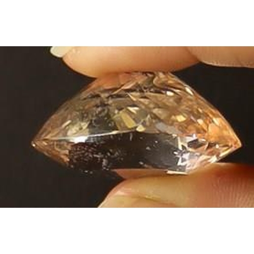 52 - GEMSTONE 75ct MORGANITE. Light peach pink colour which measures 29.85 X 25.58 X 17.10 mm. Comes with... 