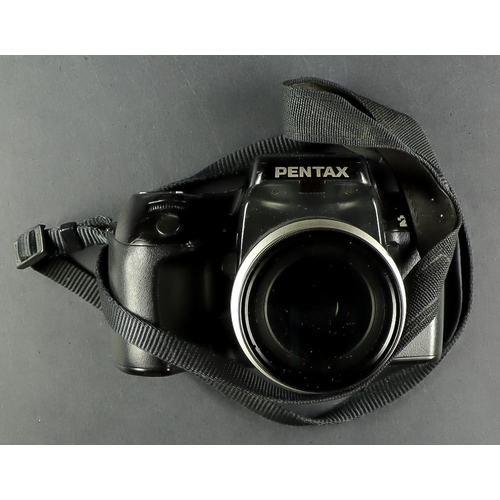 68 - PENTAX CAMERAS. A varied selection of 7 Pentax cameras, both film and digital models. Includes Penta... 