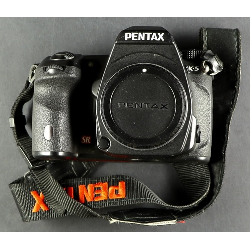 69 - PENTAX K-5. A Pentax model K-5, comes in box which includes; owner's manual, battery, battery charge... 