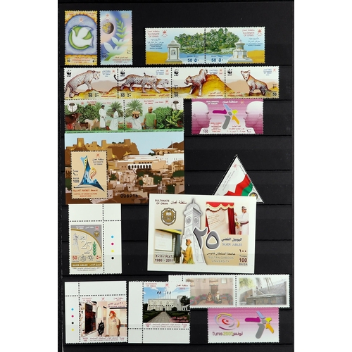 904 - OMAN 1972 - 2013 NEVER HINGED MINT COLLECTION on black stock pages, many sets (approx 150 stamps, 2 ... 