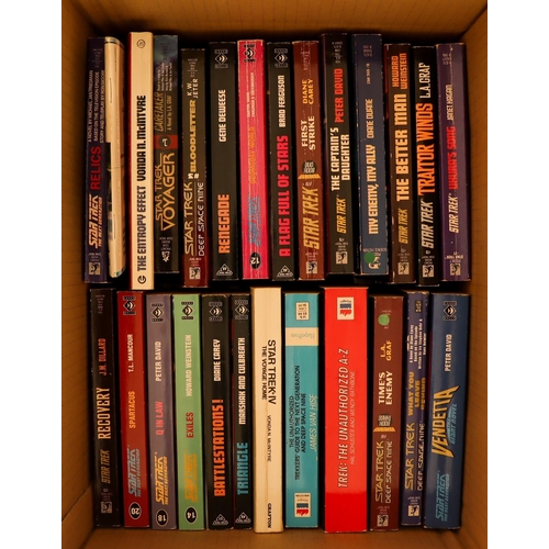 23 - STAR TREK BOOKS AND MAGAZINES. Includes, novels, companions, and an encyclopedia. Many light years o... 