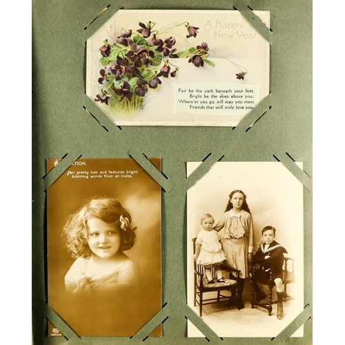 126 - GREETINGS POSTCARDS AND CARDS in albums and loose. Also includes a few pictorial cards and various p... 