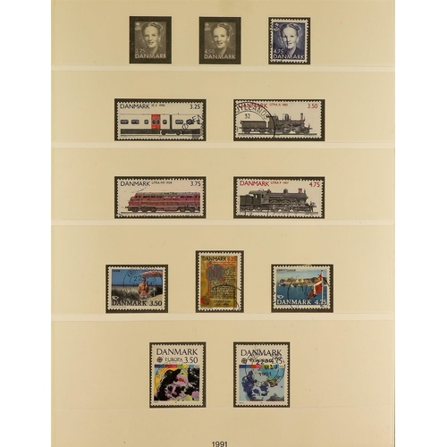 451 - DENMARK 1945 - 2010 USED COLLECTION of 1300+ stamps in three Lighthouse Denmark albums. Michel stc €... 