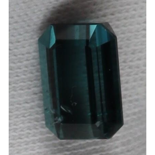 128 - GEMSTONE - TOURMALINE 4.94ct emerald cut. Comes with valuation certificate. Lot 128 [a]