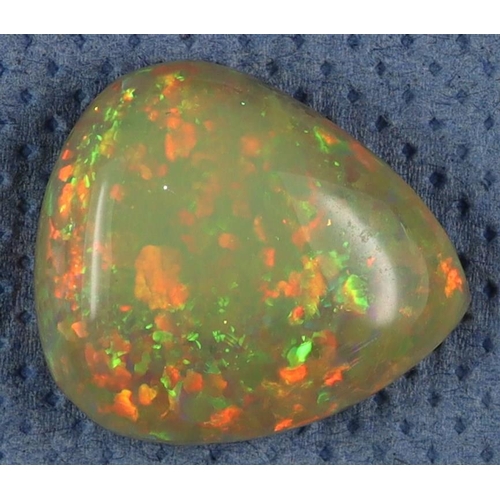 130 - GEMSTONE 28ct ETHIOPIAN OPAL. Pear shape with an opaque white dominance and splashes filling the bod... 