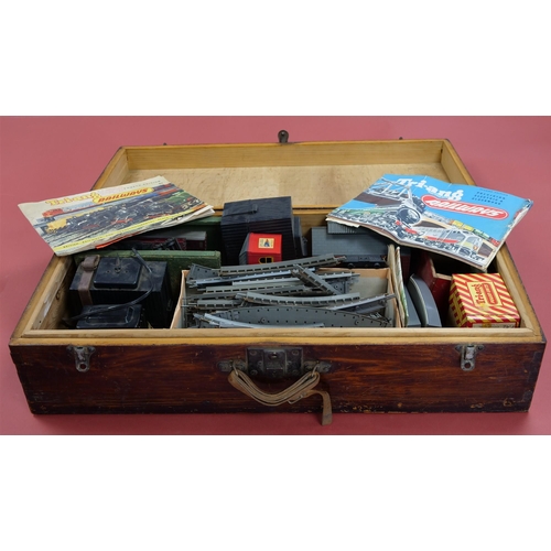 198 - TRI-ANG TRAIN SET IN WOODEN BOX. Includes engine, carriages, platform, buildings, untested transform... 