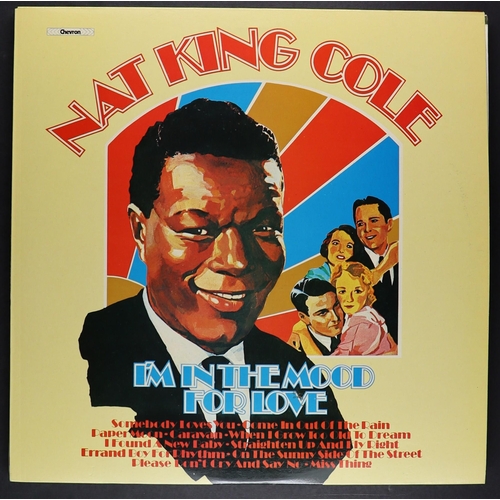 215 - VINYL RECORDS - NAT KING COLE AND LOUIS ARMSTRONG. A selection of 33 rpm albums. Louis Armstrong inc... 