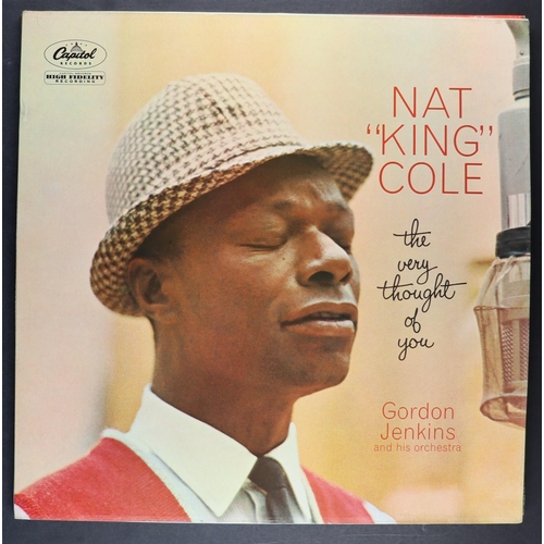 215 - VINYL RECORDS - NAT KING COLE AND LOUIS ARMSTRONG. A selection of 33 rpm albums. Louis Armstrong inc... 