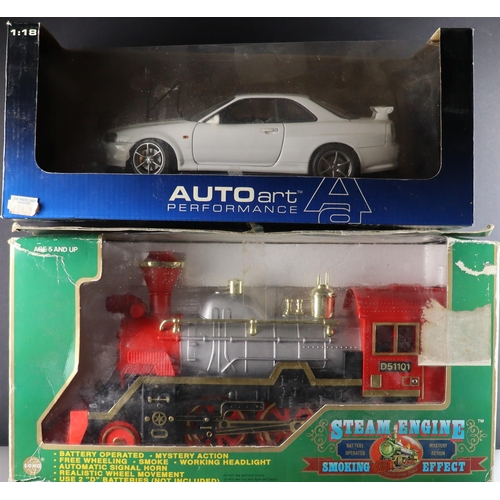 24 - BOXED CARS and other items. Includes Burago Chevrolet, Maisto Porsche, Auto Art Nissan, Big Ballers ... 