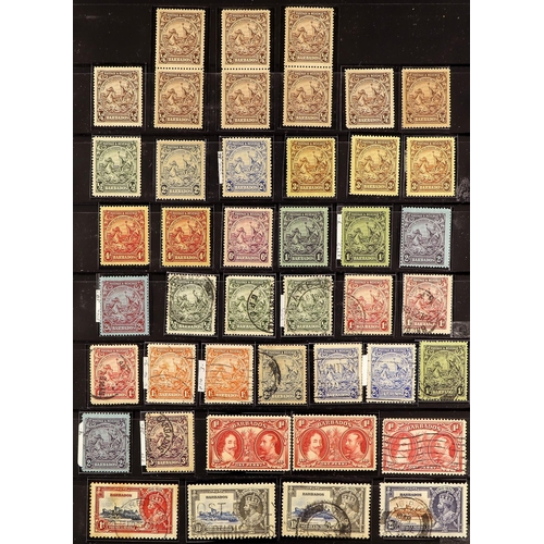 275 - BARBADOS 1861 - 1935 ASSORTMENT of mint and used stamps on protective pages, Britannias to 1s, 1916-... 