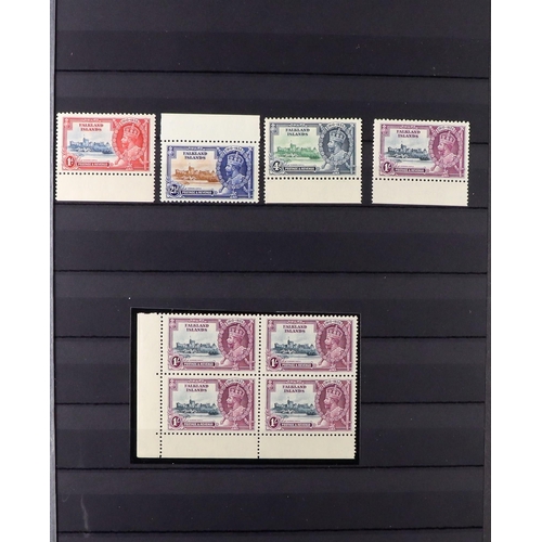 46 - 1935 SILVER JUBILEE ISSUE SPECIALIZED COLLECTION in 2 large stock books, includes mint (almost entir... 