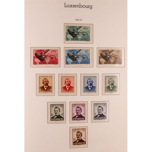 906 - LUXEMBOURG 1945-1986 COMPLETE NEVER HINGED MINT COLLECTION in hingeless Lighthouse album, includes 1... 