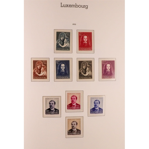 906 - LUXEMBOURG 1945-1986 COMPLETE NEVER HINGED MINT COLLECTION in hingeless Lighthouse album, includes 1... 