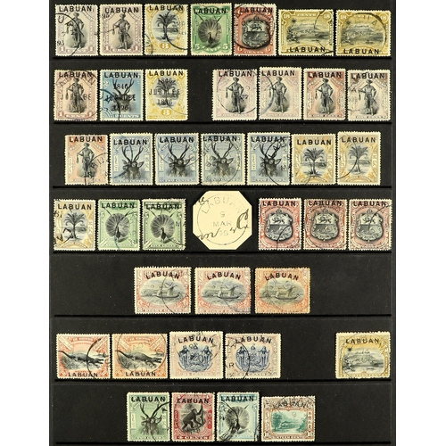 907 - LABUAN 1894 - 1902 USED STAMPS WITH POSTAL CANCELS. A collection of 39 stamps with attractive cds ca... 