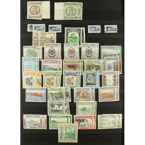 489 - COLOMBIA 1946 - 1963 MINT & USED COMPANION COLLECTIONS in a stock book, near - complete for the mint... 