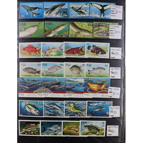 107 - WORLD TOPICAL RETAIL FOLDERS Mostly 1970's-1990's chiefly never hinged mint stamps, sets & mini-shee... 