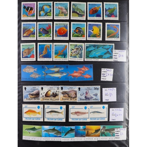 107 - WORLD TOPICAL RETAIL FOLDERS Mostly 1970's-1990's chiefly never hinged mint stamps, sets & mini-shee... 