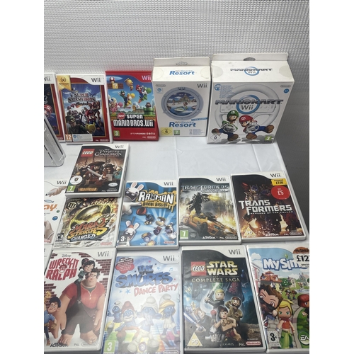 6 - A large lot of Nintendo Wii Games and Wii Console to include Boxed Mario Kart and Steering Wheel, Su... 