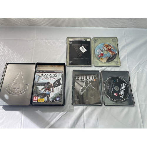 31 - Playstation 3 steelbook collection.Grand theft auto 5 steel bookAssassins creed black flag steel boo... 