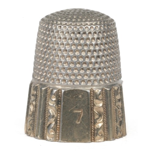 24 - American Simon Bros Sterling Silver Thimble. Fluted octagon with gold band. Inside dome marked with ... 