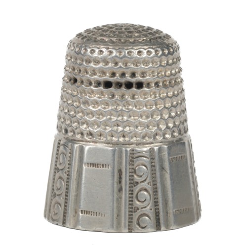 26 - American Waite Thresher Co. Rhode Island Thimble. Panelled rim. Sterling silver mark and the 