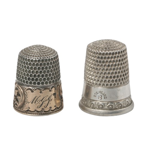 32 - Two American Thimbles by The Simon Bros.
1 - Plain band and wave decoration on band above rim.  Mark... 