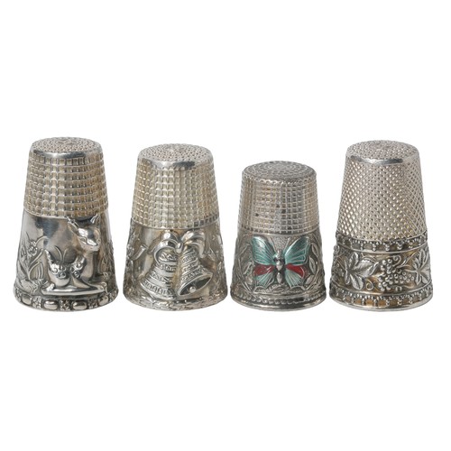 39 - A Collection of Four Ornate Sterling Silver Thimbles:
1 - Scenery of deer, trees and flowers on band... 