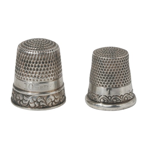 45 - Two American Sterling Silver Thimbles.
1 - Reversed scroll on rim.  Inside dome marked sterling and ... 