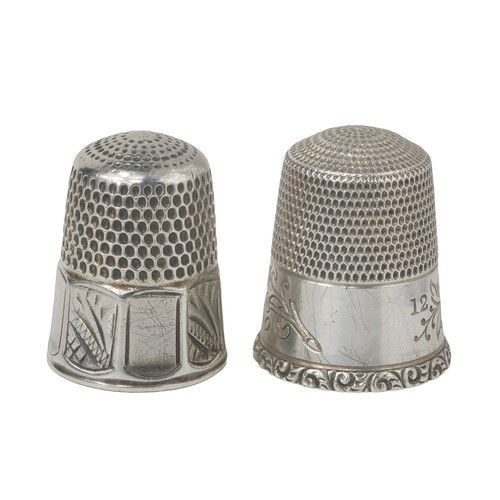 47 - Two American Simon Bros Thimbles:
1 - Decorative band of two birds on a branch with leaves and flowe... 