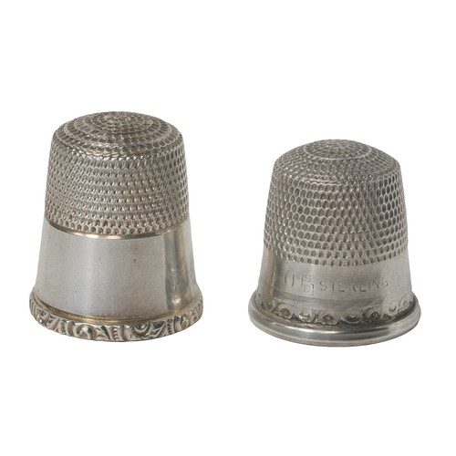 52 - Two Interesting American Sterling Silver Thimbles:
1 - Dimpled top, plain band with narrow decorativ... 