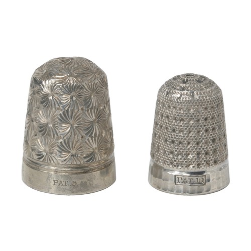 53 - Two Dorcas Thimbles:
1 - Filigree silver over the steel. Wide faceted band at base.  Marked PAT.10. ... 