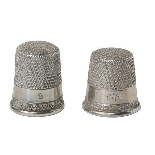 57 - Two American Simon Bros Sterling Silver Thimbles:
1 - Marked sterling. Decorated with border of aste... 