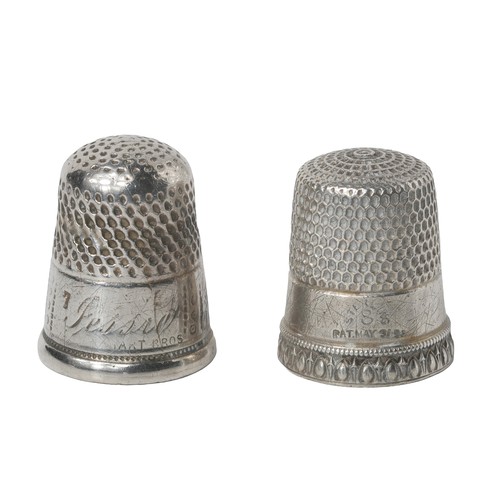 61 - Two American Thimbles: Hart Bros & Simon Bros.
1 - Decorated with egg and dart border and punched do... 