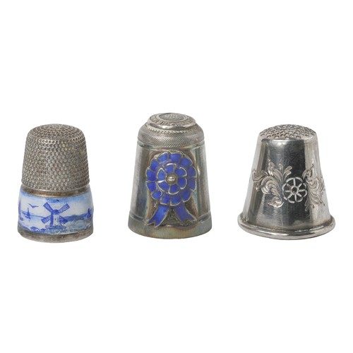 75 - Collection of Three Interesting Thimbles
1 - Dutch-style with blue and white enamel band with figure... 