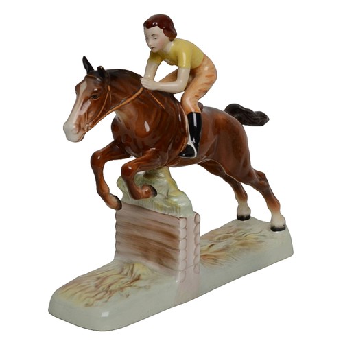 4 - Beswick - Girl on Jumping Horse. Damage to one ear.