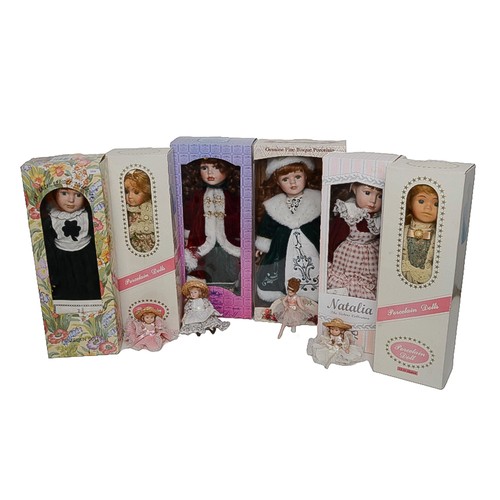 14 - Collection of Porcelain Dolls. Includes:
- Collector's Choice Fine Bisque Porcelain. Boxed.
- The Kn... 