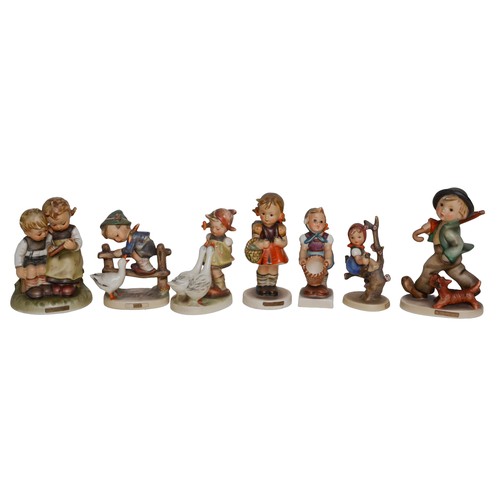 34 - Collection of 7 Hummel Figures. As found with some with damage/repairs.