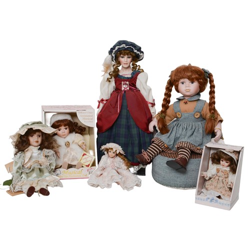 28 - Collection of Porcelain Dolls including:
- Collector's Choice Musical Wind Up Animated Doll which pl... 