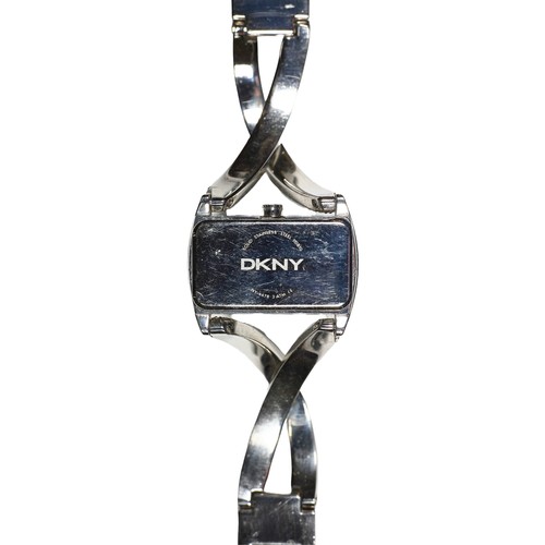 105 - DKNY Ladies Twist Bangle Watch. Stainless steel and crystal embellishment.