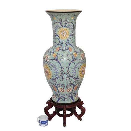 51 - Large Oriental Decorative Vase on Wooden Base. Pale blue with dark blue, pink and yellow floral patt... 