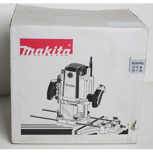 90 - Makita Router. 110v. Brand new in box. RP2301FCX.