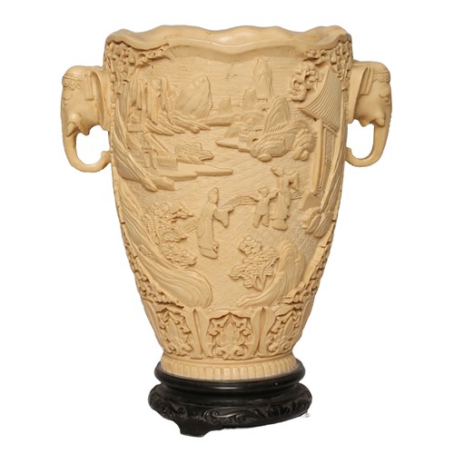 75 - Oriental Faux Ivory Vase. Approx. 31cm high with elephant mask handles to both sides.