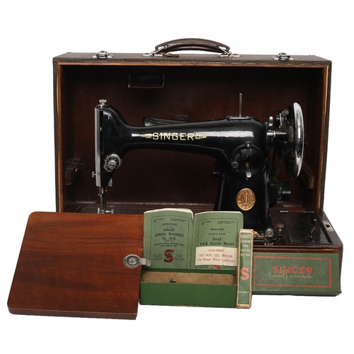 170 - Singer Sewing Machine Model 201K. Electric and includes foot pedal (untested). Heavy machine!
Comple... 