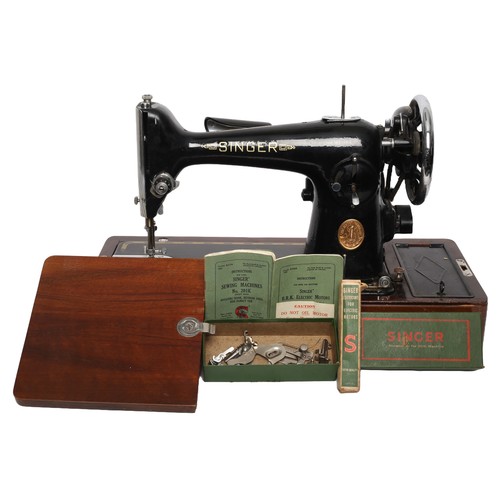 170 - Singer Sewing Machine Model 201K. Electric and includes foot pedal (untested). Heavy machine!
Comple... 