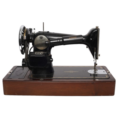 170 - Singer Sewing Machine Model 201K. Electric and includes foot pedal (untested). Heavy machine!
Comple... 