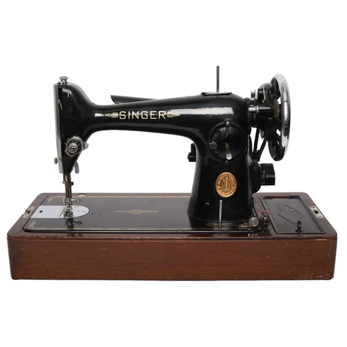 170 - Singer Sewing Machine Model 201K. Electric and includes foot pedal (untested). Heavy machine!
Comple... 