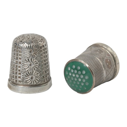 281 - Two James Swann Thimbles:
1 - James Swann & Sons 1972. Decorated band on rim and green stone set top... 