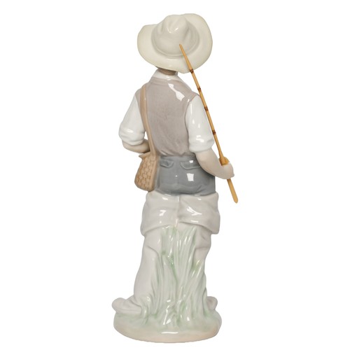 25 - Lladro Fisher Boy. No. 4809. In original box. In perfect condition with no signs of any damage.