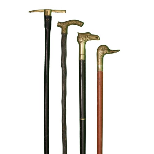 87 - 4 Brass Headed Walking Sticks. Includes:
1 x Alpenstock design. Approx 87cm
1 x Oriental design with... 